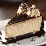 Kahlua Mudslide Cheesecake: A Decadent Dessert Delight Indulge in the rich, creamy layers of this Kahlua Mudslide Cheesecake, where the bold flavors of coffee and cream liqueurs meet a buttery graham cracker crust. This dessert combines the best of a classic cheesecake with the indulgent taste of a mudslide cocktail, making it a perfect choice for special occasions or a luxurious treat. Why You’ll Love This Recipe Rich Flavor Profile: The combination of Kahlua coffee liqueur, Bailey’s Irish Cream, and water infuses the cheesecake with deep, complex flavors. Buttery Graham Crust: A crisp, golden crust provides the perfect base, adding texture and enhancing the overall taste. Make-Ahead Convenience: This cheesecake can be prepared a day in advance, allowing the flavors to meld and making it ideal for entertaining. Impressive Presentation: Its elegant appearance and indulgent taste make it a showstopper at any gathering. Ingredients For the Graham Crust 1¾ cups graham cracker crumbs ¼ cup granulated sugar 6 tablespoons unsalted butter, melted For the Cheesecake Filling 3 packages (8 oz each) cream cheese, at room temperature 1 cup granulated sugar 1 tablespoon pure vanilla extract or 2 teaspoons vanilla bean paste 3 large eggs, at room temperature ⅓ cup Kahlua coffee liqueur ⅓ cup Bailey’s Irish Cream liqueur 3 tablespoons water Optional Toppings Kahlua chocolate sauce or whipped cream (Tip: You'll find the full list of ingredients and measurements in the recipe card below.) Directions Step 1: Prepare the Graham Crust Preheat your oven to 350°F (175°C). In a mixing bowl, combine graham cracker crumbs and granulated sugar. Add melted butter and mix until the crumbs are evenly coated. Press the mixture into the bottom and up the sides of a 9-inch springform pan. Bake for 8–10 minutes, or until golden brown. Remove from oven and set aside to cool. Step 2: Prepare the Cheesecake Filling In a large mixing bowl, beat the softened cream cheese and granulated sugar until smooth and creamy. Add eggs one at a time, beating well after each addition. Stir in vanilla extract. In separate bowls, divide the cheesecake mixture evenly. To one bowl, add Kahlua and mix until incorporated. To the other bowl, add Bailey’s Irish Cream and water, mixing until well combined. Pour the Bailey’s mixture into the prepared crust. Gently pour the Kahlua mixture over the back of a spoon onto the center of the cheesecake to create a layered effect. Using a skewer or knife, swirl the two mixtures together to achieve a marbled appearance. Step 3: Bake the Cheesecake Place a large, heat-safe bowl of water on the rack directly beneath where the cheesecake will be placed. This helps prevent cracks on the top of your cheesecake while baking. Bake the cheesecake for 40 minutes. Turn off the oven, crack the door, and allow the cheesecake to bake for an additional 10–15 minutes. Remove from oven and let cool completely. Cover loosely and refrigerate for several hours or overnight. Step 4: Serve Before serving, top with Kahlua chocolate sauce or whipped cream, if desired. Slice and enjoy the rich, creamy layers of this indulgent dessert. Servings and Timing Servings: 12 slices Prep Time: 30 minutes Cook Time: 50 minutes Chill Time: 4–6 hours Total Time: 5–7 hours Variations Non-Alcoholic Version: Substitute the liqueurs with coffee extract and Irish cream-flavored syrup for a similar taste without the alcohol. Mini Cheesecakes: Prepare the cheesecake in a muffin tin for individual servings. Flavor Add-ins: Incorporate chocolate chips or chopped nuts into the filling for added texture. Storage/Reheating Storage: Keep the cheesecake refrigerated in an airtight container for up to 5 days. Freezing: Wrap slices tightly in plastic wrap and aluminum foil; freeze for up to 2 months. Thaw in the refrigerator before serving. Reheating: Serve chilled; do not attempt to reheat as it may affect the texture. FAQs Can I make this cheesecake without alcohol? Yes, you can substitute the liqueurs with coffee extract and Irish cream-flavored syrup to mimic the flavors. How can I prevent cracks on the cheesecake? Baking the cheesecake in a water bath and allowing it to cool gradually in the oven helps prevent cracks. Can I use a different crust? While graham cracker crust is traditional, you can experiment with chocolate cookie crumbs or nuts for a different flavor. How do I achieve a marbled effect? Pour the two mixtures over the crust as directed, then use a skewer or knife to swirl them together before baking. Is this cheesecake suitable for freezing? Yes, this cheesecake freezes well. Ensure it's tightly wrapped to prevent freezer burn. Can I use low-fat cream cheese? Low-fat cream cheese can be used, but it may affect the texture and richness of the cheesecake. How do I know when the cheesecake is done? The cheesecake should be set around the edges but still slightly jiggly in the center when done. Can I make this cheesecake in advance? Yes, this cheesecake is ideal for making ahead. It needs several hours to chill and set. What can I serve with this cheesecake? Whipped cream, chocolate shavings, or a drizzle of Kahlua chocolate sauce complement this cheesecake beautifully. How do I slice the cheesecake neatly? Dip a sharp knife in hot water, wipe it dry, and slice the cheesecake for clean edges. Conclusion The Kahlua Mudslide Cheesecake is a luxurious dessert that combines the rich flavors of coffee and cream liqueurs with a creamy cheesecake filling and a buttery graham cracker crust. Its elegant presentation and indulgent taste make it a perfect choice for special occasions or a delightful treat to enjoy any time. Whether you're a coffee lover or a cheesecake enthusiast, this dessert is sure to impress and satisfy.