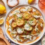 Crispy Parmesan Potatoes with Herby Yogurt and Spicy Chili Oil